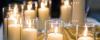 Images of candles burning at a service