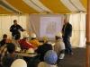 Paul Schlumper (left) conducts training with Hurricane Katrina recovery workers inside a temporary tent in 2005.