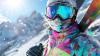 skier on mountain with snow and sun in background