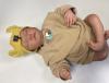 Wearable chest-mounted patch and forehead-mounted pulse oximeter shown on a mannequin baby for illustration
