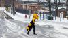 Buzz walks on campus amid ice and snow.