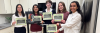 Michelle Gu, Aditi Ashok, Caitlin Woodward, Elizabeth Thompson, and Vedita Sawhney pose with Stretch and their award certificates. They won $1000 and the opportunity to develop their concept in the Aware Home. 