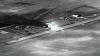  black and white aerial view of an airfield AI is helping U.S. forces find and choose targets in Iran, like this airfield. U.S. Central Command via AP