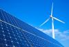 Solar panels cut across the foreground of an image featuring a blue sky and a white wind turbine