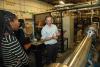 Ben Emerson, Assistant Professor of Aerospace Engineering giving a tour of the Ben T. Zinn Combustion Lab for the Summer Carbon Management Fellows