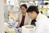 Menon and Huang in the lab