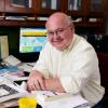 Gordon Kingsley sitting at a desk.