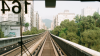 stock photo of Taipei metro with a view of tracks leading into mountains from the front window of a train