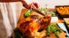 Cutting a turkey at a holiday dinner
