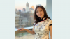 Image of Jancy posing in front of the Atlanta skyline
