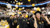 Graduating students with falling balloons at McCamish Pavilion for the fall commencement ceremony