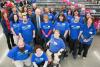 Jim McClelland with a group of Goodwill employees at the Noblesville, Indiana store. In preparation for stepping down as CEO of the central Indiana Goodwill organization, McClelland went on a “farewell tour” of all the region’s facilities in spring 2015.