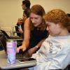 CEISMC Research Associate Jayma Koval assists a high school student during REMEZCLA summer camp.