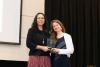 A photo of Jennifer Singh receiving the Serve-Learn-Sustain Award for Excellence in Community-Engaged Sustainability Teaching.
