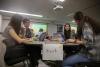 Students work on CTF competition at table.
