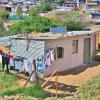 A home in Rwanda with a solar panel on the roof
