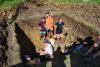 Tech students dig the foundation for a health clinic in Belize. 