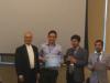 photo of Carlos Martins (2nd from left) receiving the Best Paper Award at IEEE UEMCON 2017.