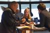 A photo of prospective students conversing with professors at the Ivan Allen College Shadow Day. 