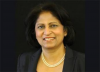 Associate Professor Usha Nair-Reichert professional headshot on gold background