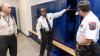 GTPD Capt. Marcus Walton demonstrates the capabilities of the new locker room facilities.