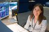 Heidi Brewer at a console at NASA's Johnson Space Center.