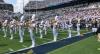 The marching band playing on the field at Bobby Dodd Stadium during pregame.