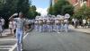 The marching band parades down Freshman Hill on its way into Bobby Dodd Stadium.