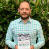 Germán Vergara holding his book Fueling Mexico