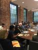 A photo of international students in the Ivan Allen College of Liberal Arts looking on during a roundtable discussion with Dean Jacqueline Royster, school chairs, and other faculty and staff. 