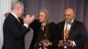 Georgia Tech President Ángel Cabrera applauds 2020 Ivan Allen Jr. Prize for Social Courage recipients Charlayne Hunter-Gault and Hamilton E. Holmes Jr., who accepted the award for his late father Hamilton E. Holmes.