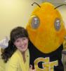 Jeannette Landers hugging Georgia Tech mascot "Buzz"