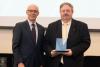 photograph of Joseph L.A. Hughes, recipient of the 2018 Georgia Tech Outstanding Service Award, with Provost Rafael Bras
