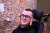 image of man in wheelchair with magtrack technology on his head 