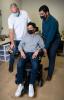 three researchers with one in a wheelchair testing the technology 