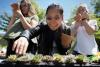 Students select succulents at a 2018 Earth Day event.