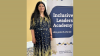 Priti Bhatia stands next to a banner for the Inclusive Leaders Academy.