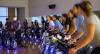People on bikes in a spin class