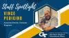 Text that reads "Staff Spotlight, Vince Pedicino, Associate Director, Graduate Programs" on top of a blue and gold background. A photo of Vince Pedicino and his dog is in a hexagonal frame on the right, and the Nunn School logo is in the bottom right corner.
