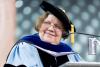 Close-up of Dr. Susan Cozzens at speakers podium in full academic regalia