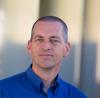 Headshot of CSE seminar speaker Vince Calhoun: caucasian male in a blue shirt.