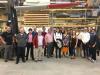 Group photo from the Re-Wind Conference in 2018 standing under a wind blade.