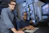 Two students, Alexander Caputo and Benjamin Pollard, in the lab