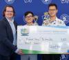 Robert Todd, president of the ACBL Educational Foundation presents the first place check for the Collegiate Pairs Championship to Richard Jeng and Bo Han Zhu.