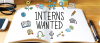 Image of an open book with the text "Interns Wanted" printed on it.