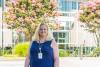 Jennifer White in front of Stamps Health Services building