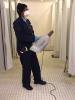 Custodian using mister for supplemental disinfecting